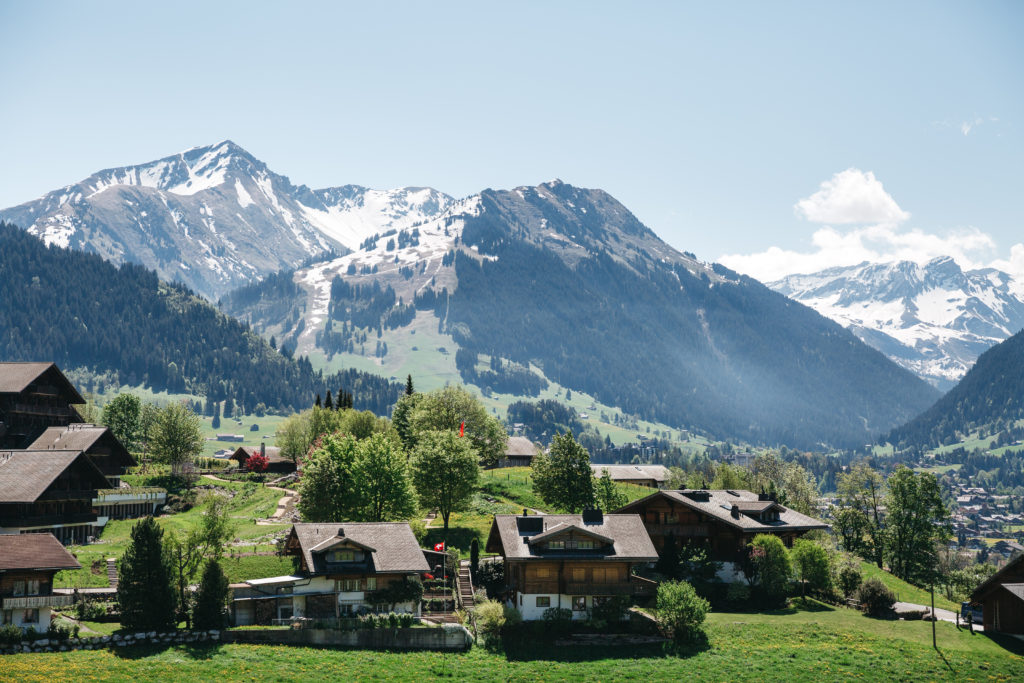 Swiss village on beautiful mountains background